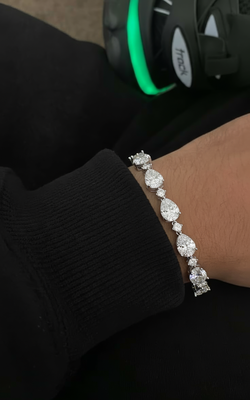 Diamond bracelet on a person's wrist with a blurred background